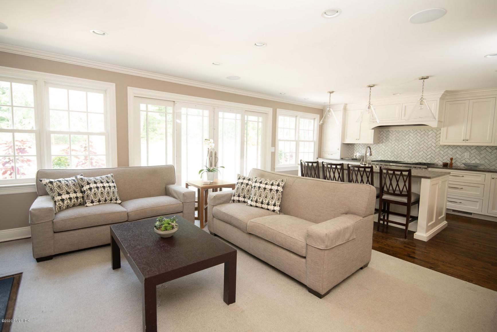 88 Birch Lane Greenwich, CT 06830 - Photo 16 of 33 a living room with furniture and a large window