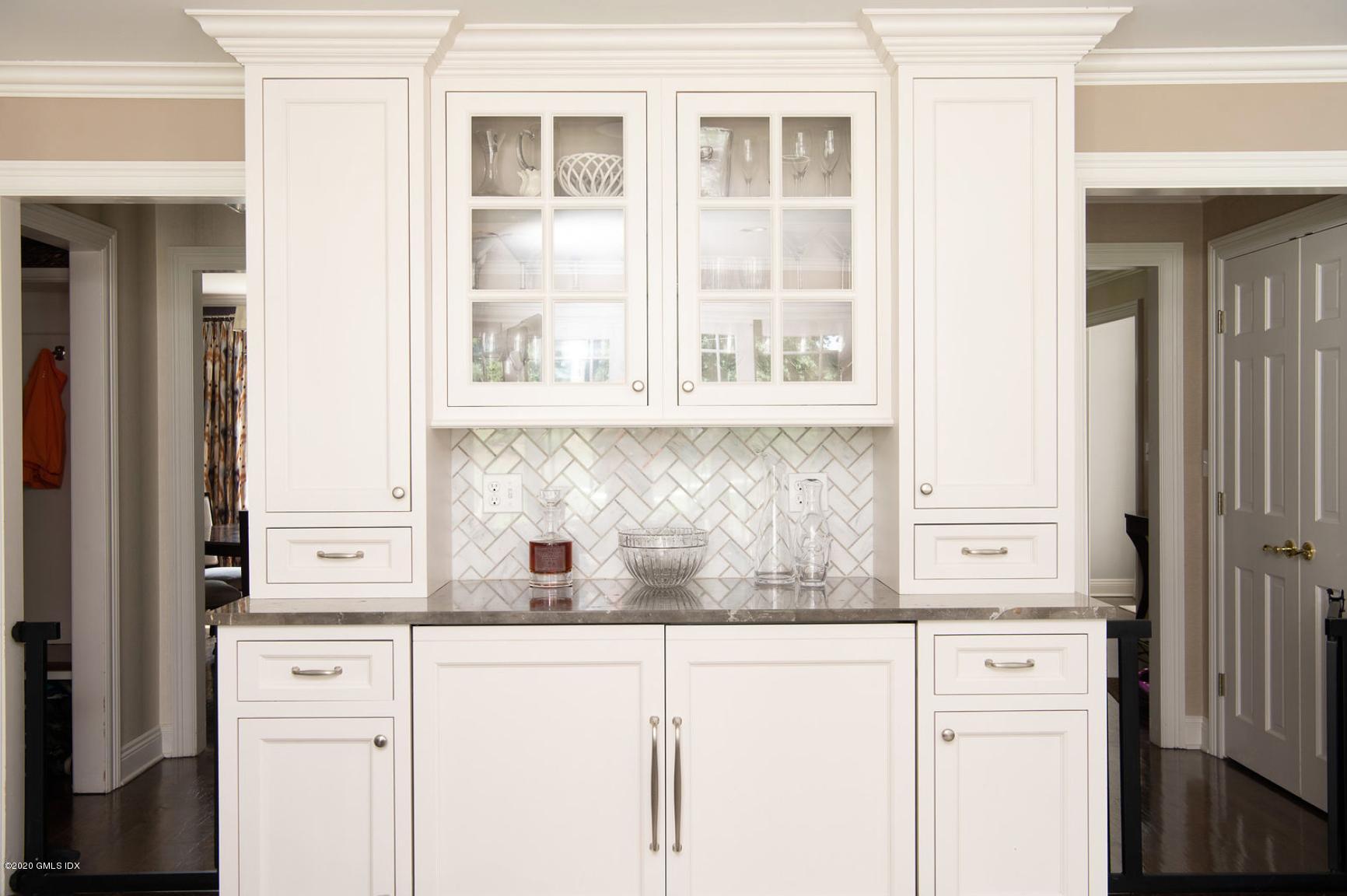 88 Birch Lane Greenwich, CT 06830 - Photo 18 of 33 a kitchen with a sink and cabinets