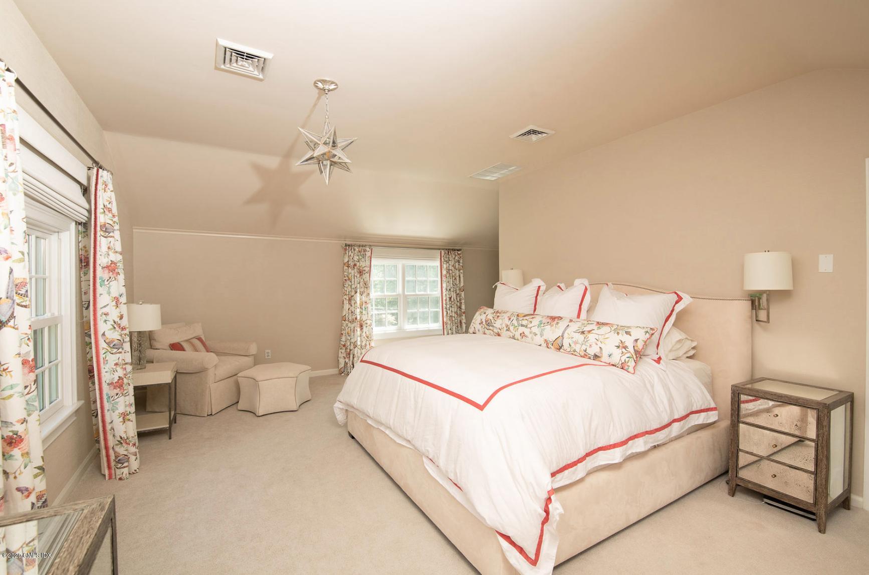 88 Birch Lane Greenwich, CT 06830 - Photo 19 of 33 a large white bed in a white room