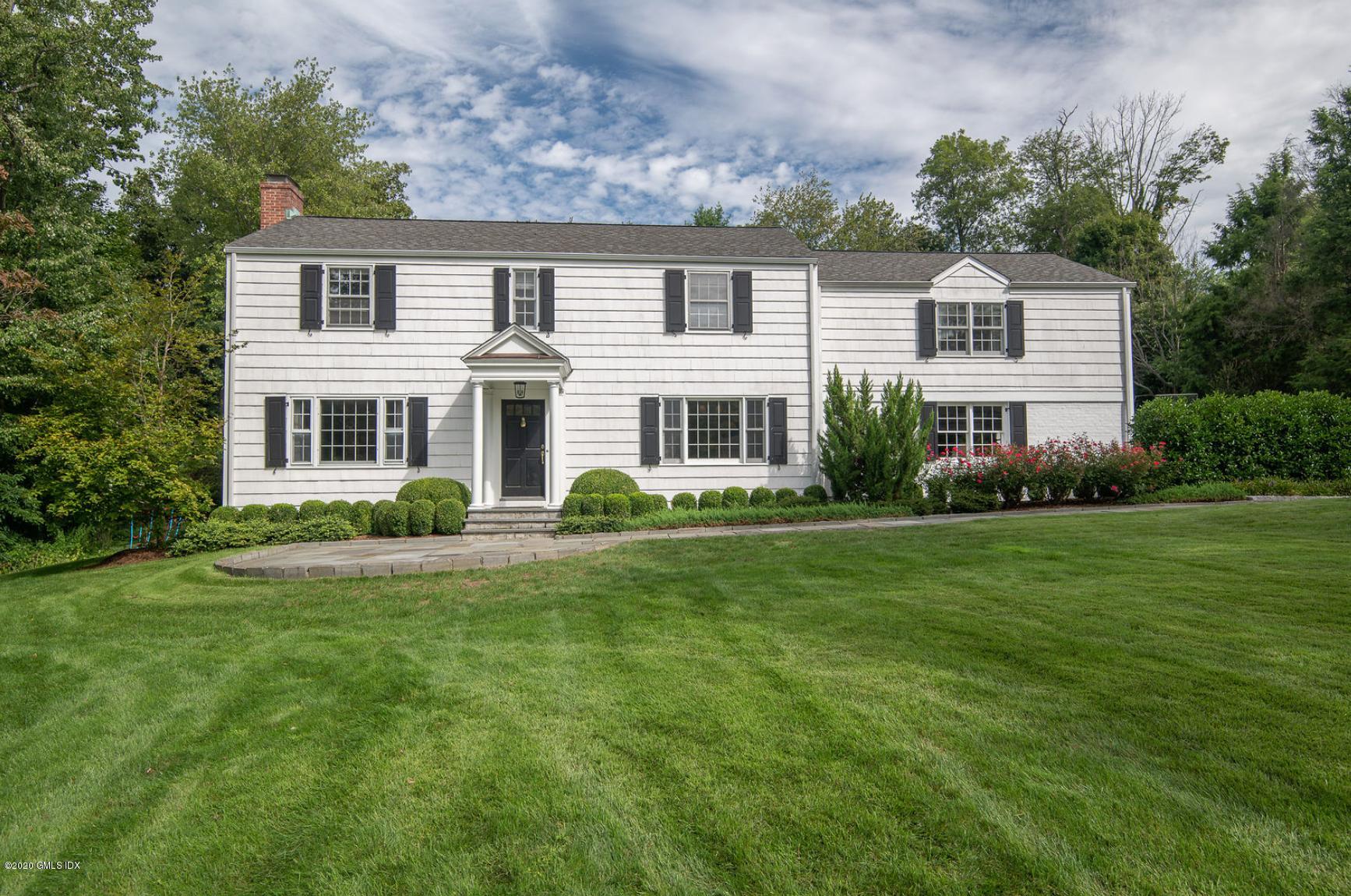 88 Birch Lane Greenwich, CT 06830 - Photo 2 of 33 a front view of house with yard and green space