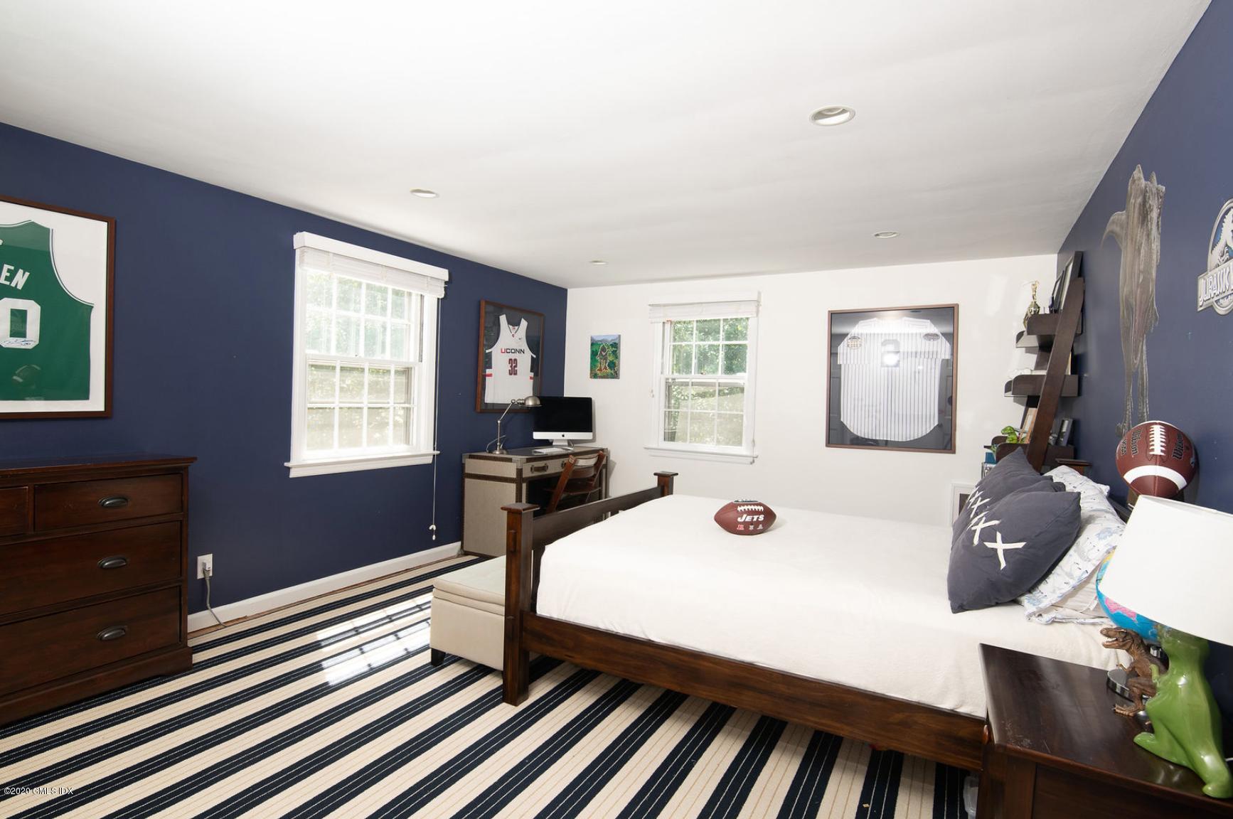 88 Birch Lane Greenwich, CT 06830 - Photo 21 of 33 a living room with furniture and a window