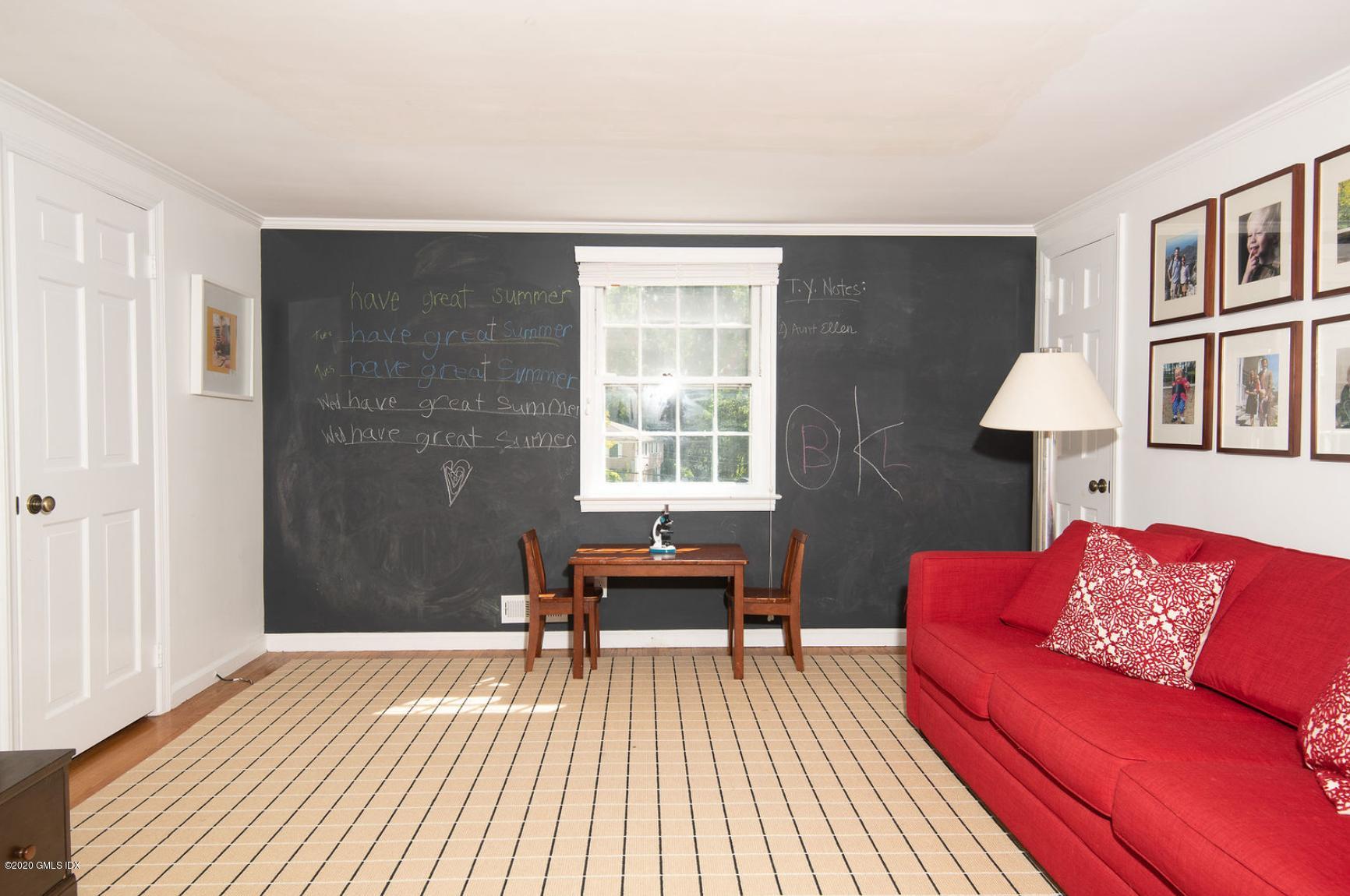 88 Birch Lane Greenwich, CT 06830 - Photo 23 of 33 a living room with furniture and a window