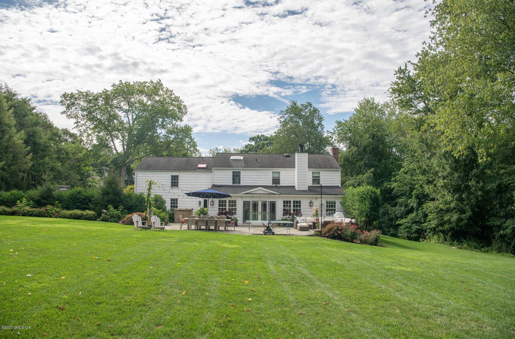 88 Birch Lane Greenwich, CT 06830 - Photo 3 of 33 a view of a big yard with a large trees