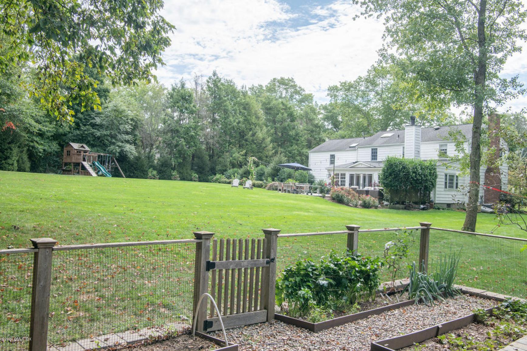 88 Birch Lane Greenwich, CT 06830 - Photo 9 of 33 a view of a house with a yard and sitting area