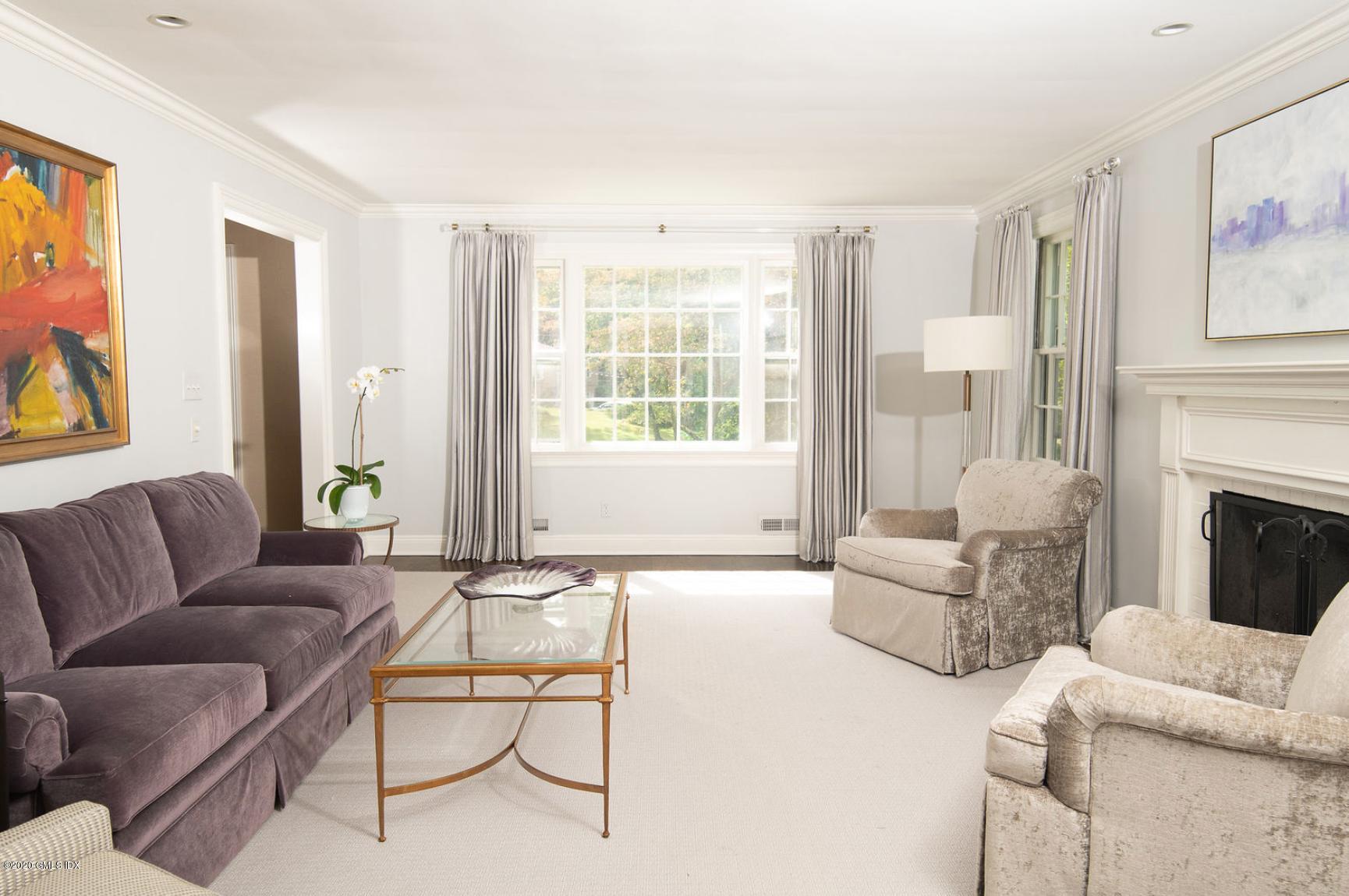 88 Birch Lane Greenwich, CT 06830 - Photo 10 of 33 a living room with furniture and a large window