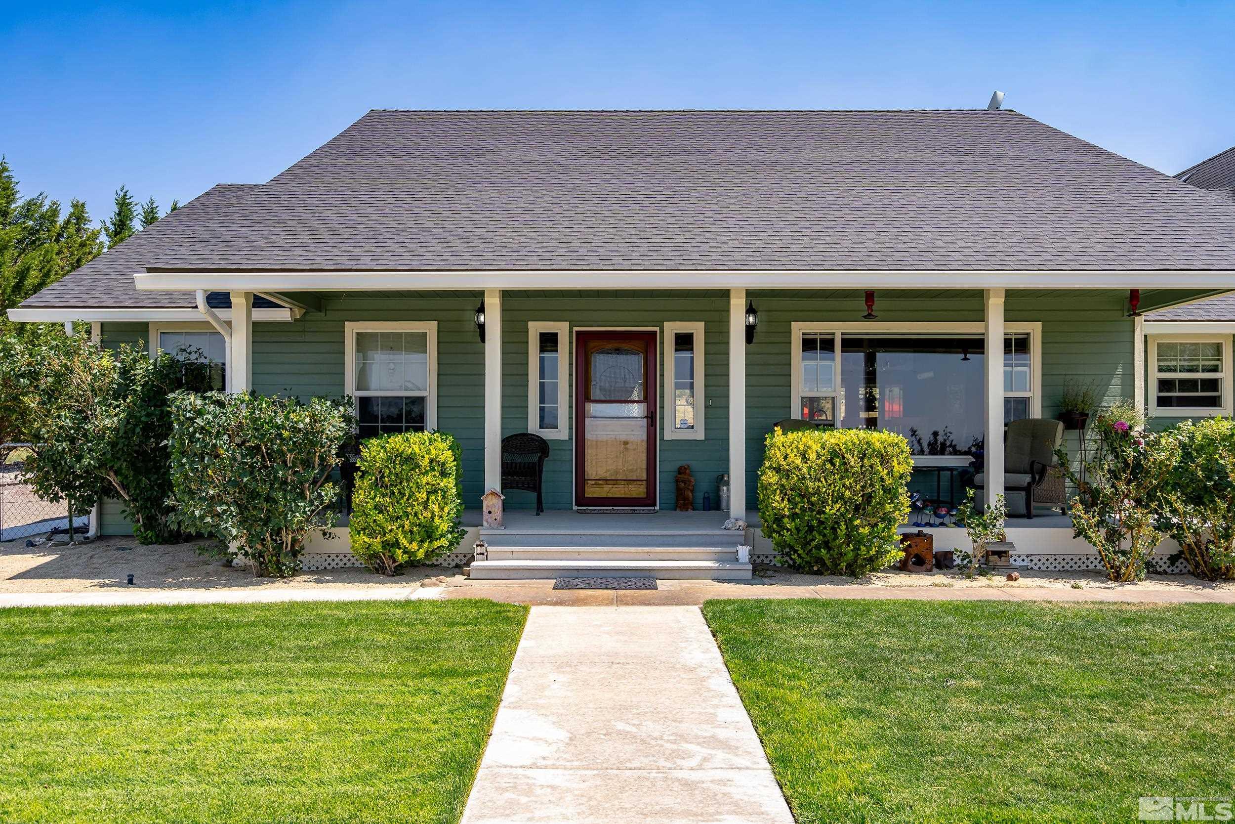 15025 North Red Rock Road Reno, NV 89508 - Photo 1 of 40 a front view of a house with a yard