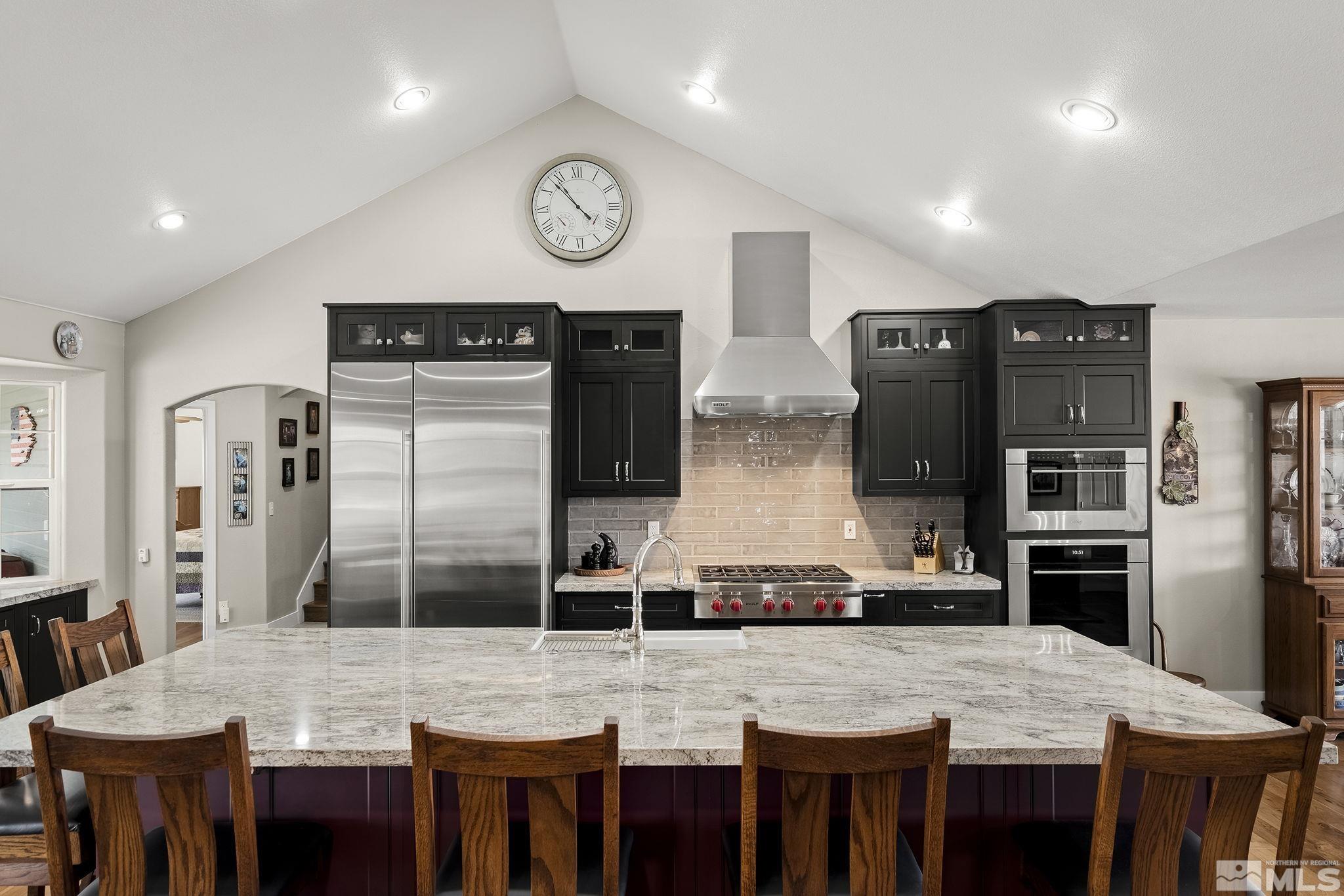 15025 North Red Rock Road Reno, NV 89508 - Photo 23 of 40 a large kitchen with a table and chairs