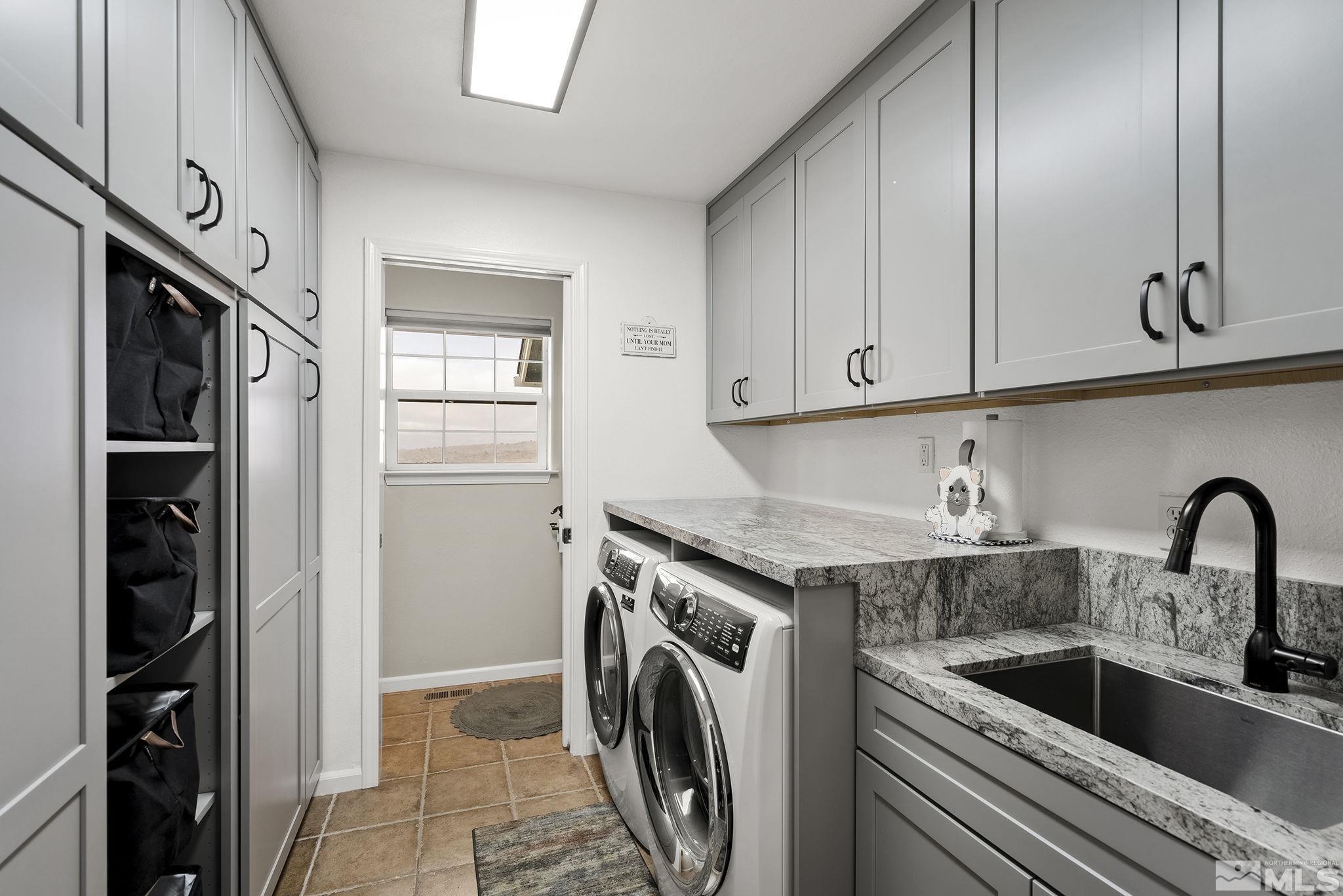 15025 North Red Rock Road Reno, NV 89508 - Photo 27 of 40 a kitchen with a sink and a washer dryer