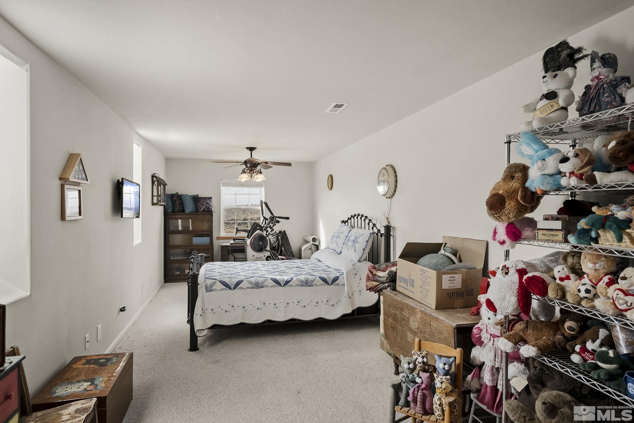 15025 North Red Rock Road Reno, NV 89508 - Photo 33 of 40 a bedroom with bed and a closet