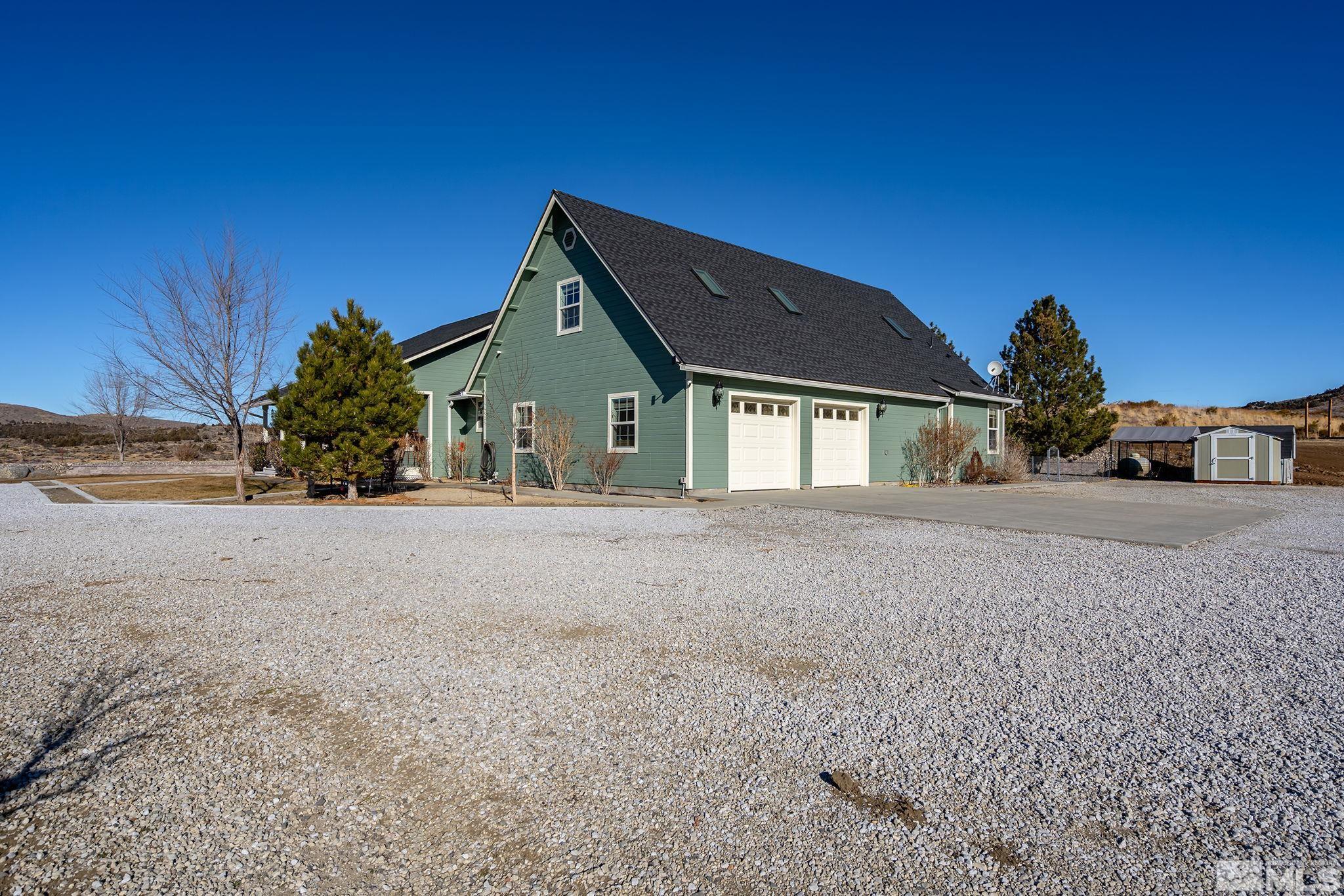 15025 North Red Rock Road Reno, NV 89508 - Photo 8 of 40 a view of a house with a yard