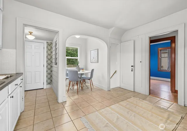 a kitchen with stainless steel appliances a stove a refrigerator and cabinets