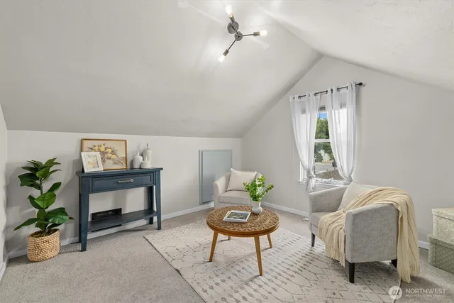 a bedroom with a bed and a potted plant