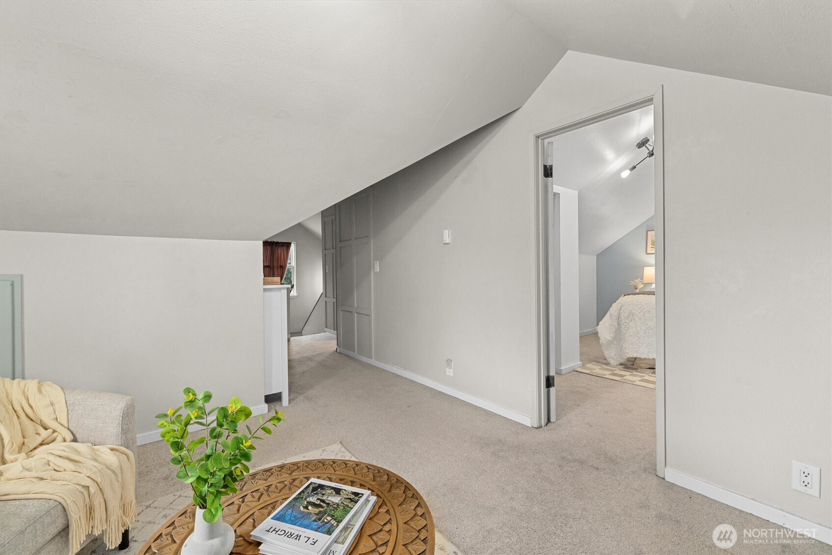 1211 North 3rd Street Renton, WA 98057 - Photo 19 of 40 a bedroom with a bed and a potted plant