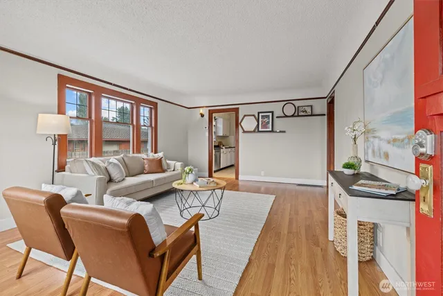 a living room with furniture and a rug