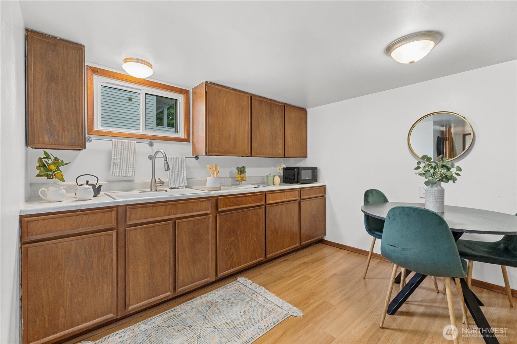 1211 North 3rd Street Renton, WA 98057 - Photo 22 of 40 a kitchen with sink cabinets and window