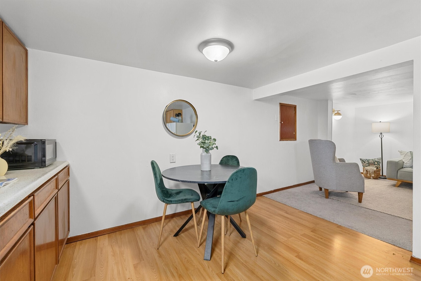 1211 North 3rd Street Renton, WA 98057 - Photo 23 of 40 a workspace with furniture and wooden floor