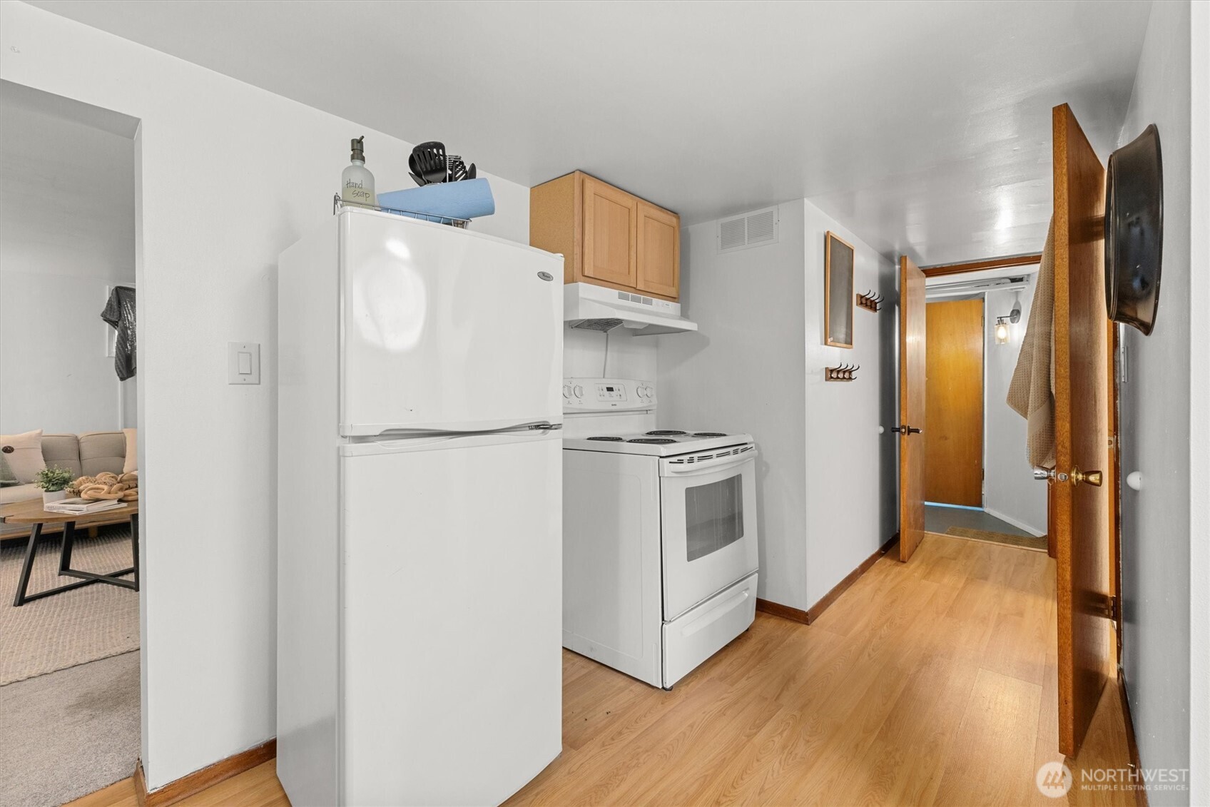 1211 North 3rd Street Renton, WA 98057 - Photo 25 of 40 a white refrigerator freezer sitting inside of a kitchen