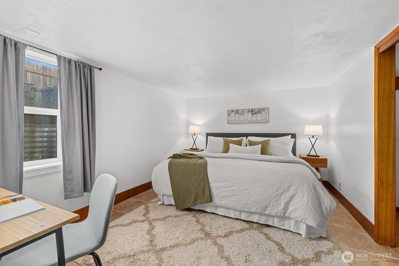 1211 North 3rd Street Renton, WA 98057 - Photo 29 of 40 a bedroom with a bed and a window