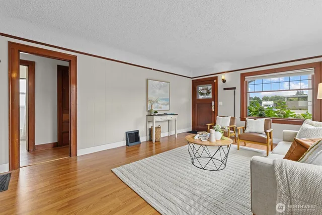 a living room with furniture and a table