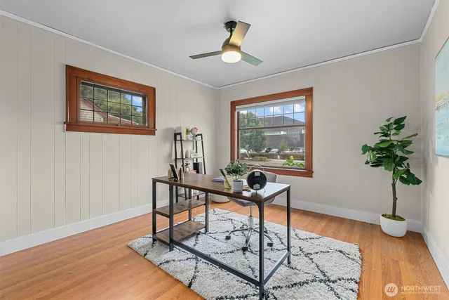 a living room with furniture and a potted plant