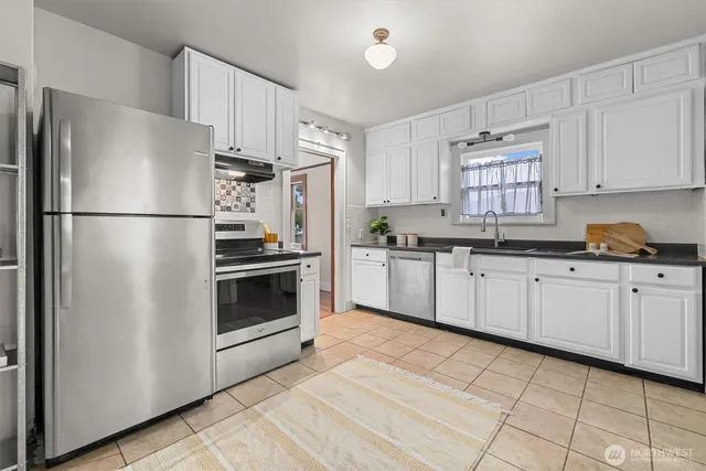 a view of a livingroom with furniture and front door