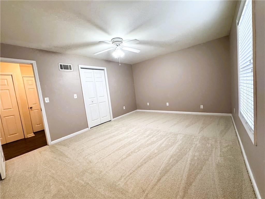 112 Summer Place Northwest Norcross, GA 30071 - Photo 17 of 24 wooden floor in an empty room with a window