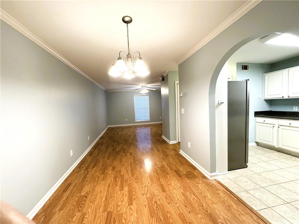 112 Summer Place Northwest Norcross, GA 30071 - Photo 6 of 24 a view of a kitchen with stainless steel appliances granite countertop a refrigerator and a sink