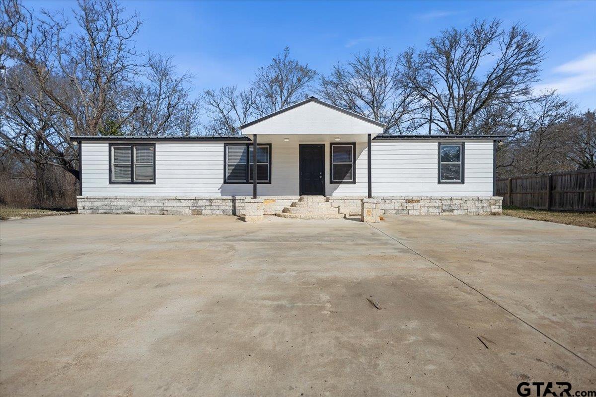 5950-c R 486 C R 486 Tyler, TX 75706 - Photo 1 of 19 a front view of house with yard covered in snow