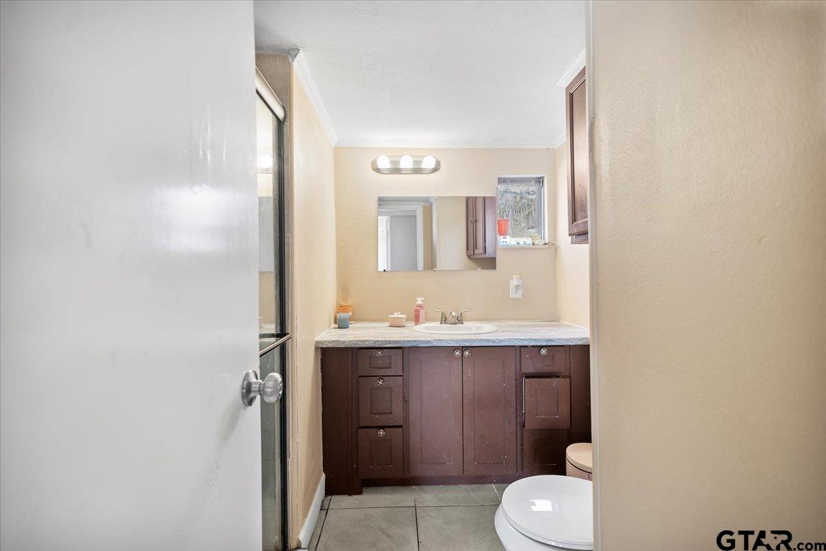5950-c R 486 C R 486 Tyler, TX 75706 - Photo 14 of 19 a bathroom with a sink a toilet and mirror
