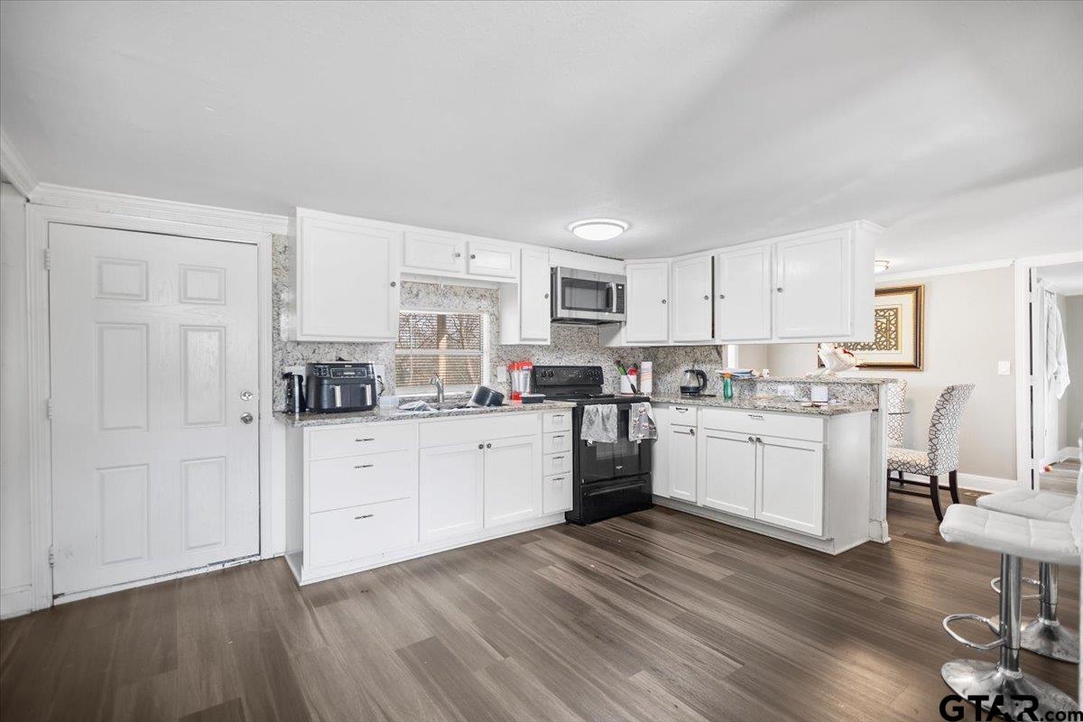 5950-c R 486 C R 486 Tyler, TX 75706 - Photo 10 of 19 a kitchen with sink refrigerator and cabinets