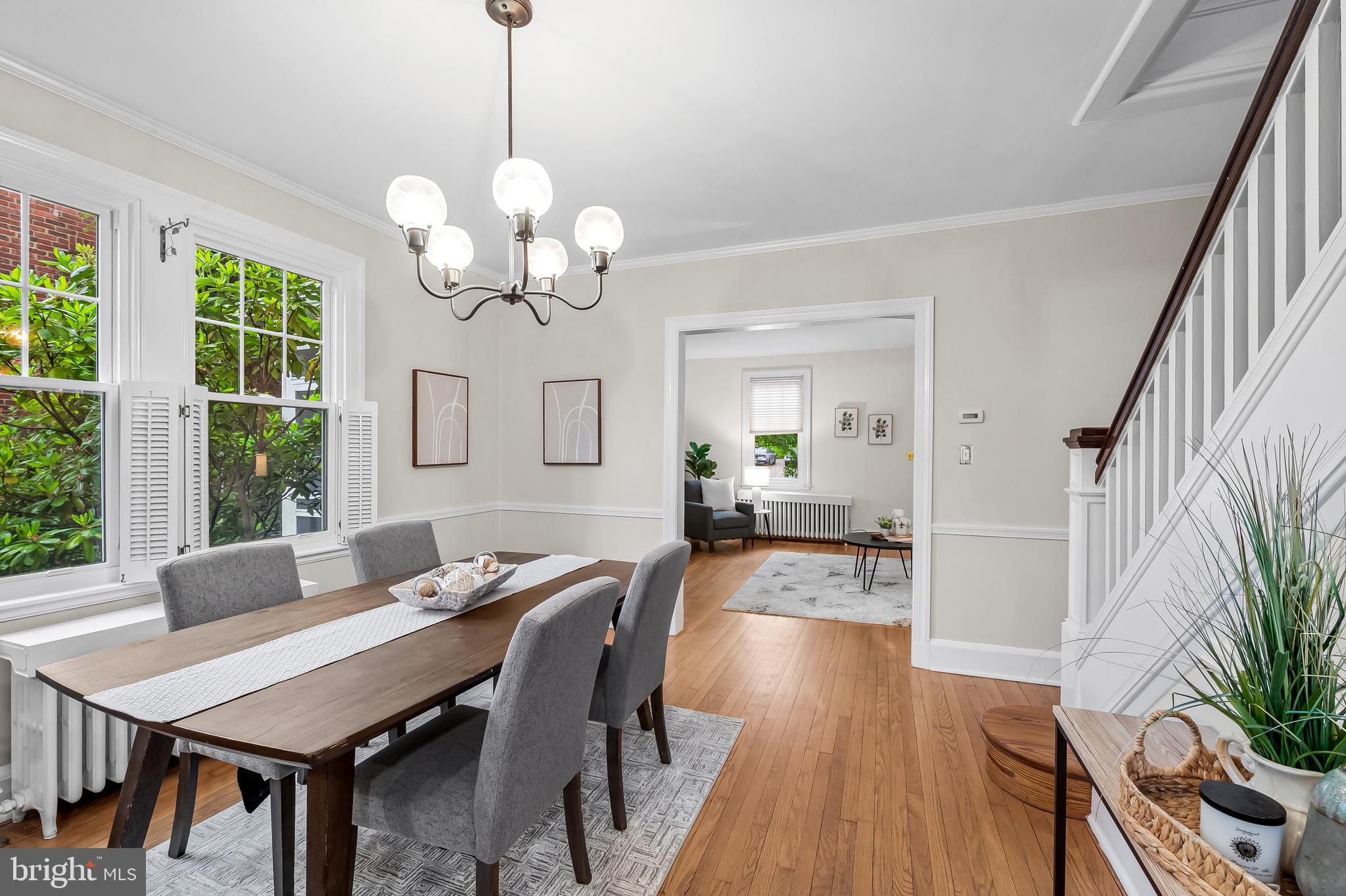 529 Overbrook Road Baltimore, MD 21212 - Photo 11 of 40 a view of a dining room with furniture a chandelier and wooden floor