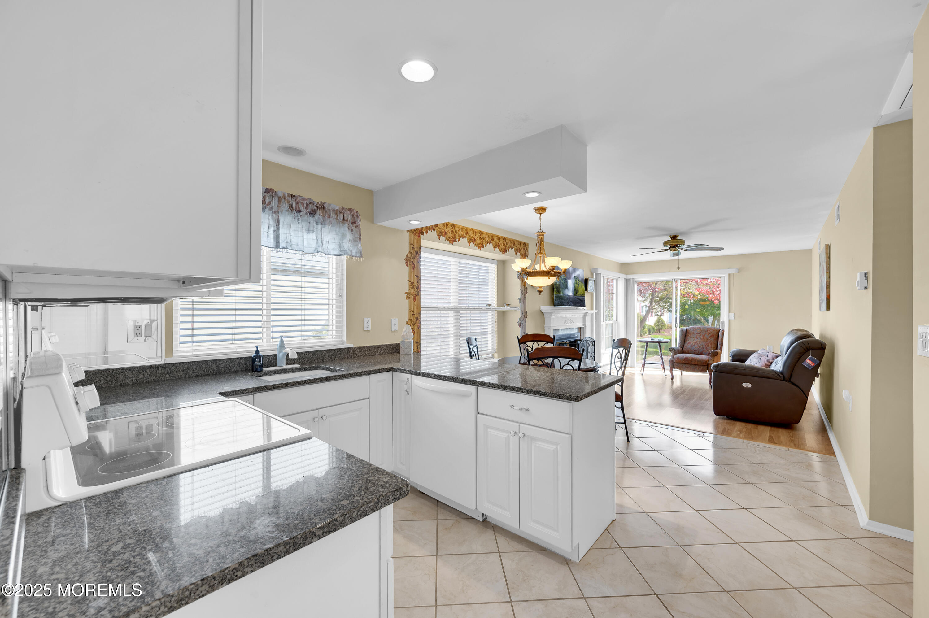 41 Red Hill Road Manchester Township, NJ 08759 - Photo 22 of 39 a large white kitchen with granite countertop a sink and cabinets