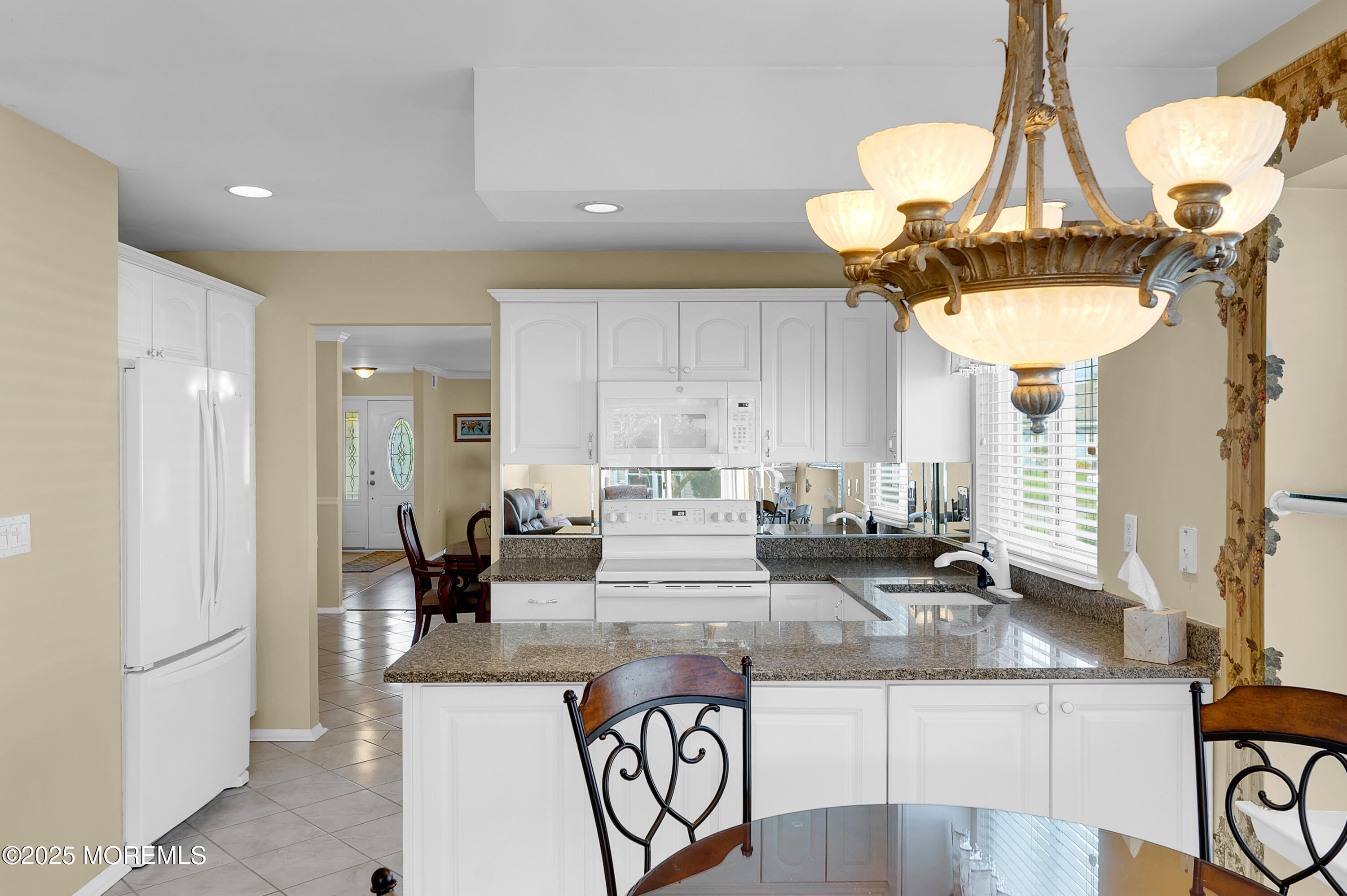 41 Red Hill Road Manchester Township, NJ 08759 - Photo 24 of 39 a kitchen with stainless steel appliances granite countertop a stove a sink and a white refrigerator