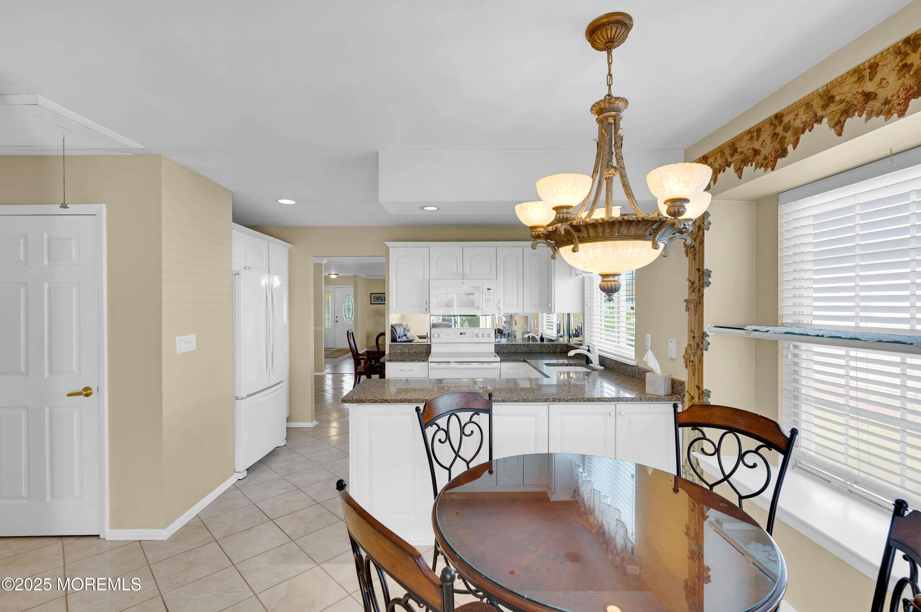 41 Red Hill Road Manchester Township, NJ 08759 - Photo 25 of 39 a dining room filled chandelier and kitchen view