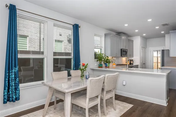 a kitchen with a table and chairs in it