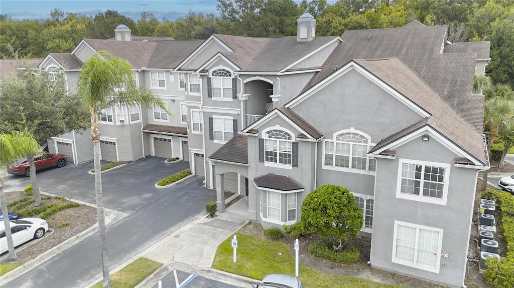 an aerial view of a house with a yard