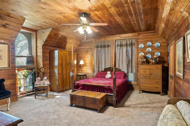 a bedroom with bed and window