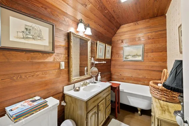 a bathroom with a sink a mirror and a bathtub