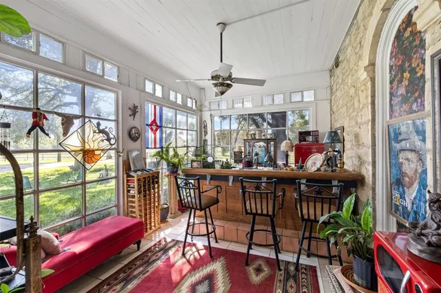 a view of a dining room with furniture window and outside view