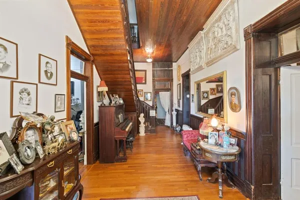 a room with lots of wooden furniture