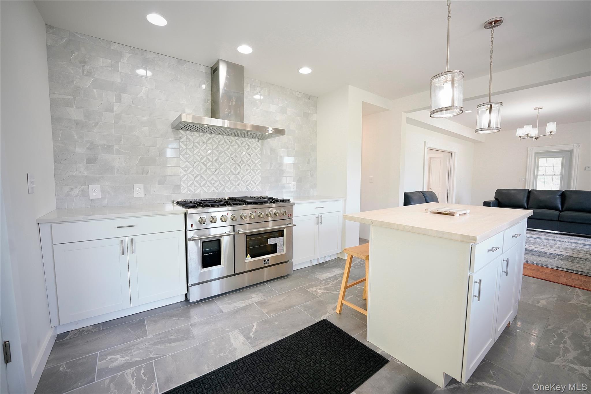 70 Royce Road Bethel, NY 12786 - Photo 12 of 48 a kitchen with a stove a sink and a refrigerator