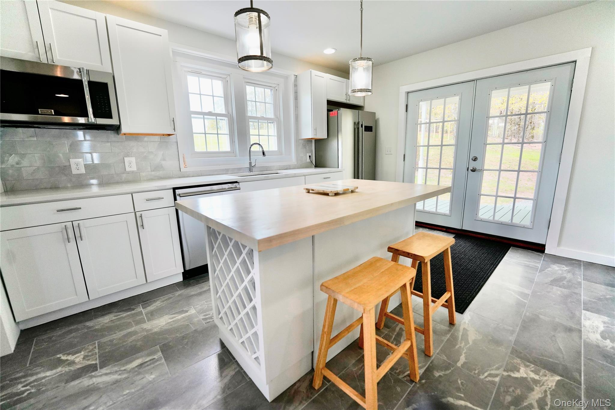 70 Royce Road Bethel, NY 12786 - Photo 14 of 48 a kitchen that has a sink window and cabinets