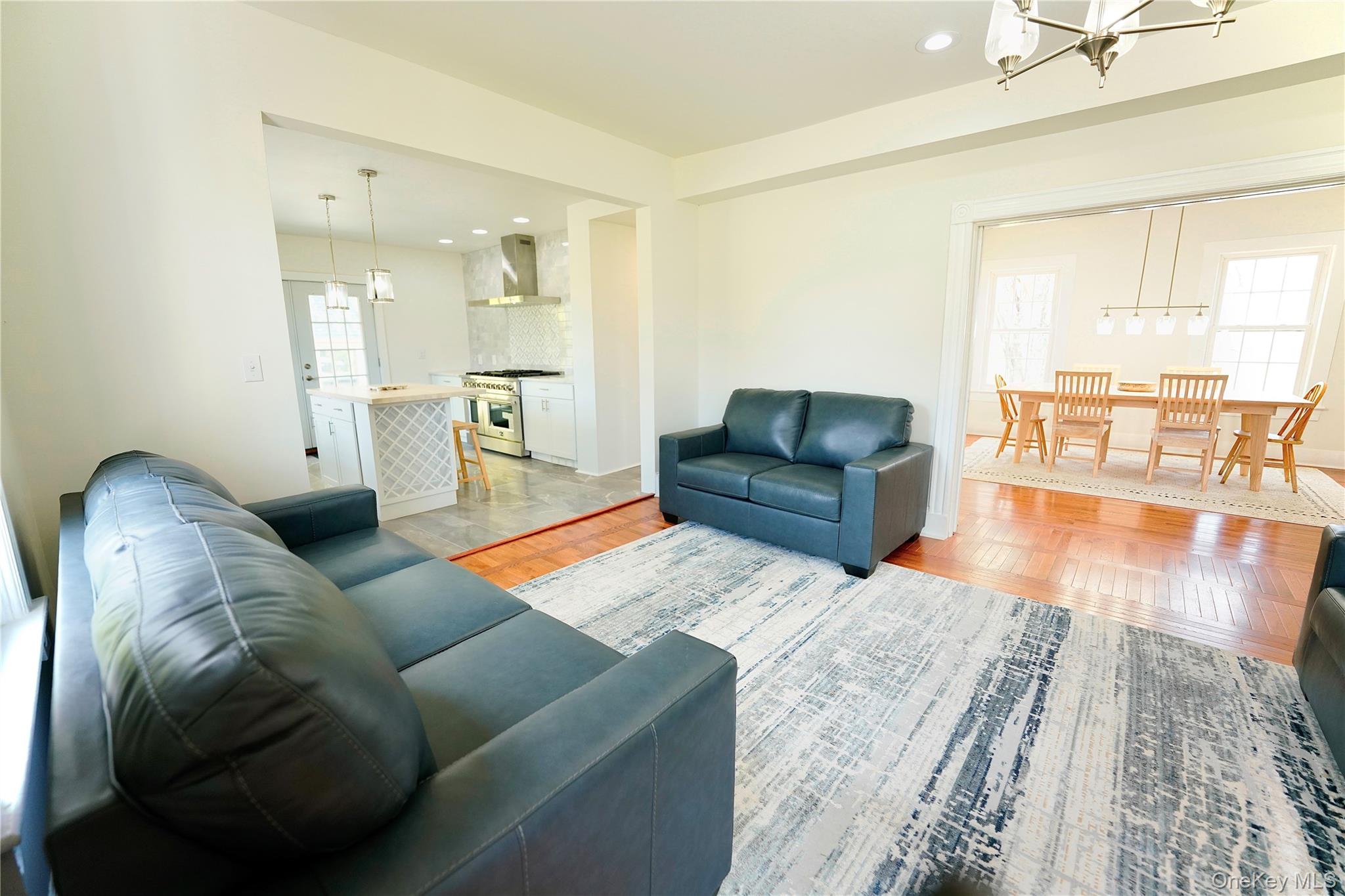 70 Royce Road Bethel, NY 12786 - Photo 18 of 48 a living room with furniture and a wooden floor
