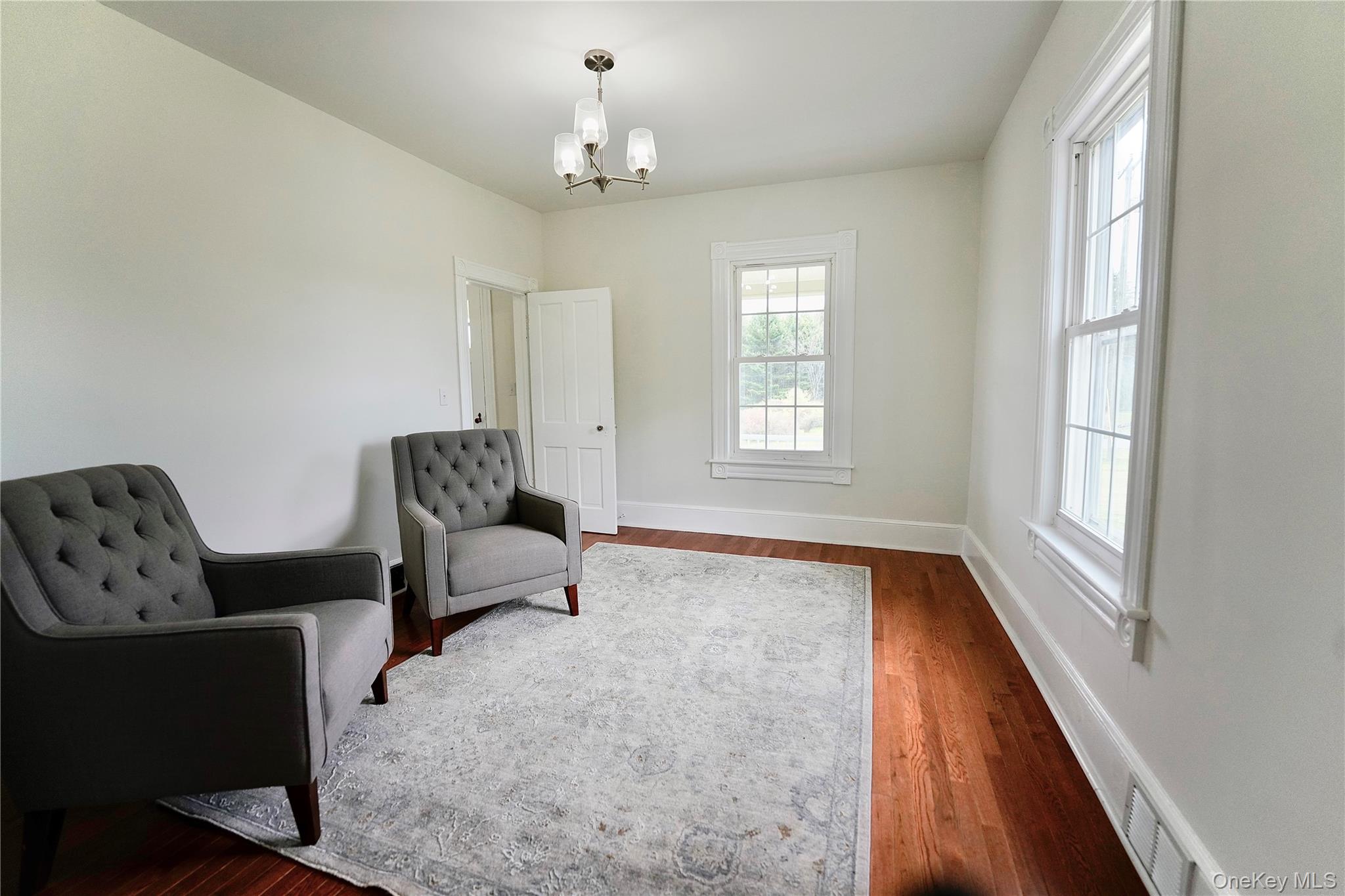 70 Royce Road Bethel, NY 12786 - Photo 24 of 48 a spacious bedroom with furniture and windows