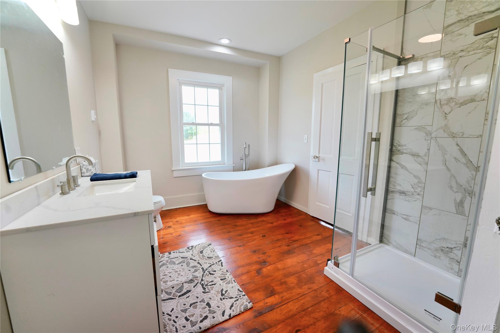 70 Royce Road Bethel, NY 12786 - Photo 35 of 48 a bathroom with a tub sink toilet and shower