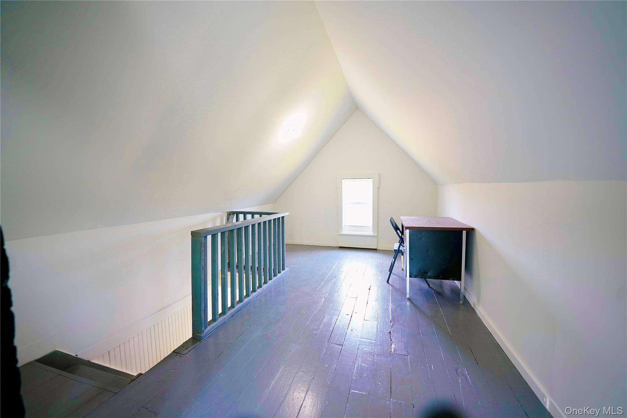 70 Royce Road Bethel, NY 12786 - Photo 39 of 48 a view of empty room with wooden floor and fireplace