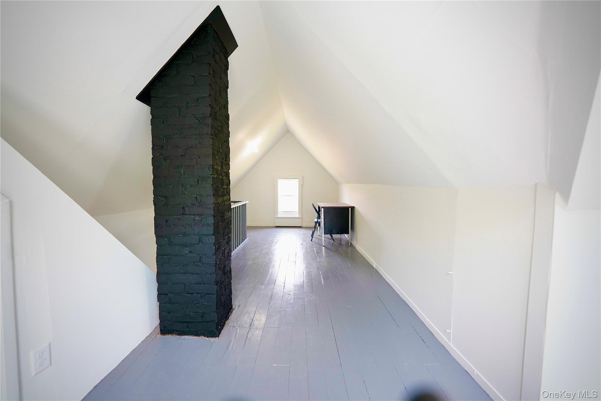 70 Royce Road Bethel, NY 12786 - Photo 40 of 48 a view of main area with wooden floor and staircase