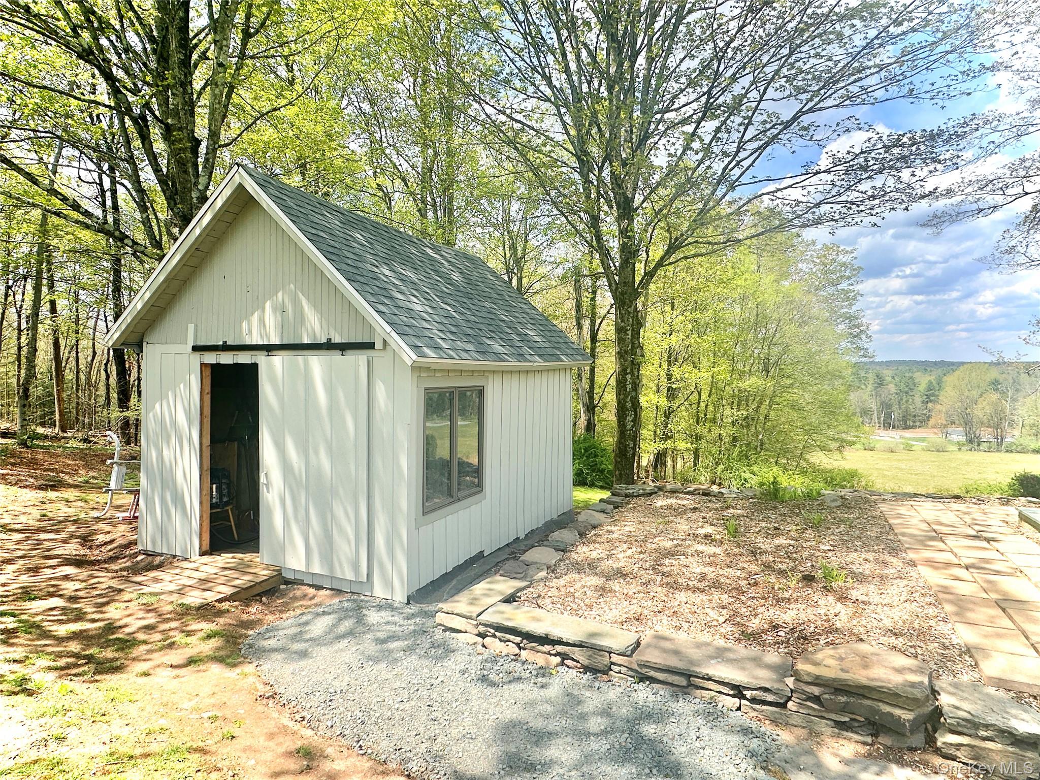 70 Royce Road Bethel, NY 12786 - Photo 43 of 48 a view of a house with a yard and garage
