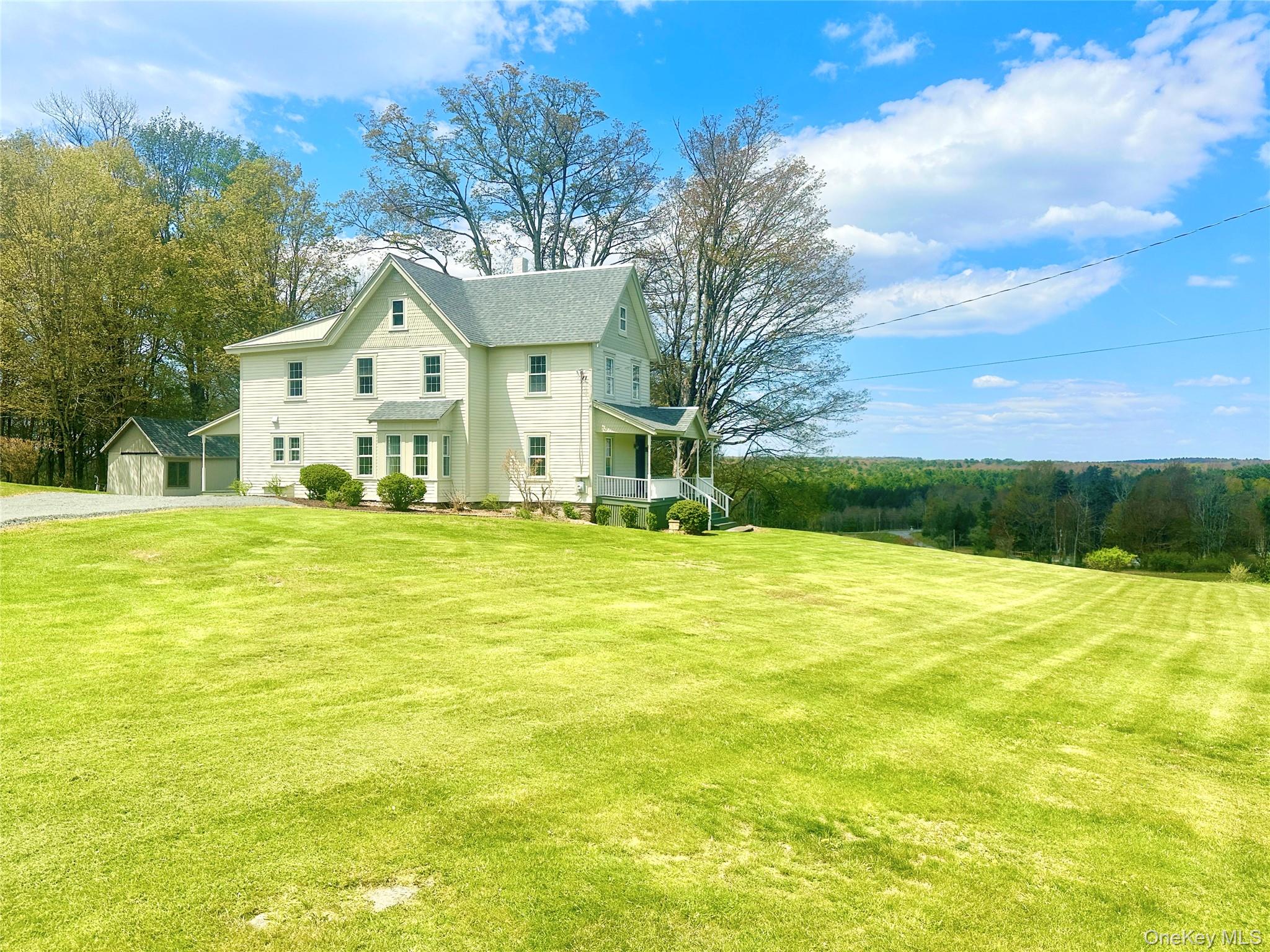70 Royce Road Bethel, NY 12786 - Photo 7 of 48 a front view of a house with a yard