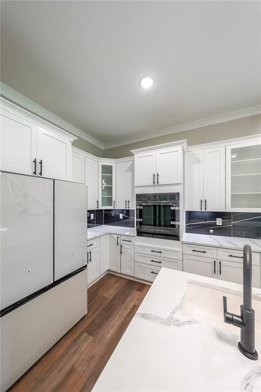 1360 Dickens Road Northwest Lilburn, GA 30047 - Photo 14 of 45 a kitchen with a refrigerator sink and cabinets